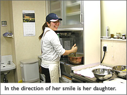 In the direction of her smile is her daughter